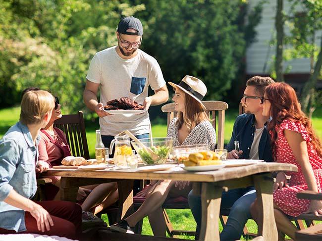 A family enjoying Christmas lunch outdoors