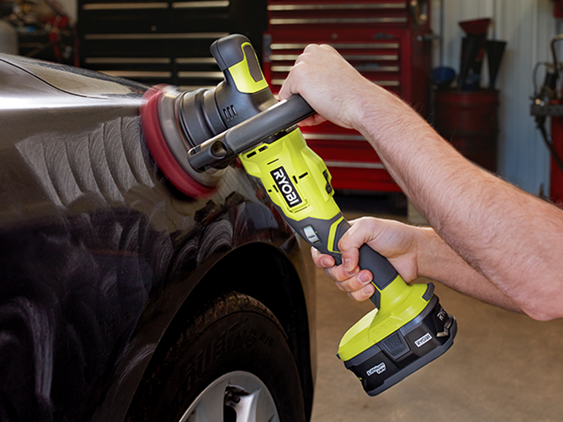 Ryobi random orbital polisher removing scuffs from black car