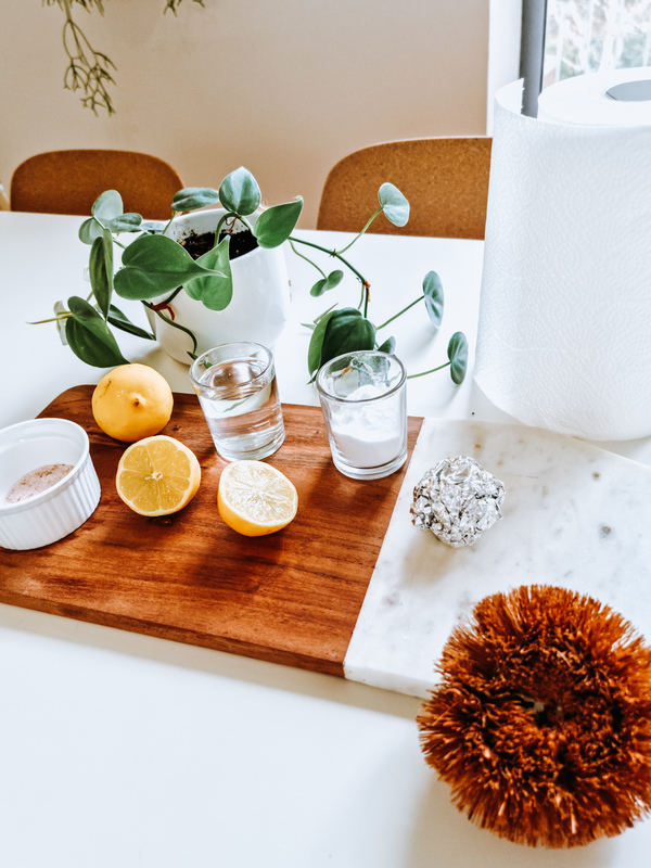 Non Chemical Cleaning ingredients displayed on a wooden chopping board