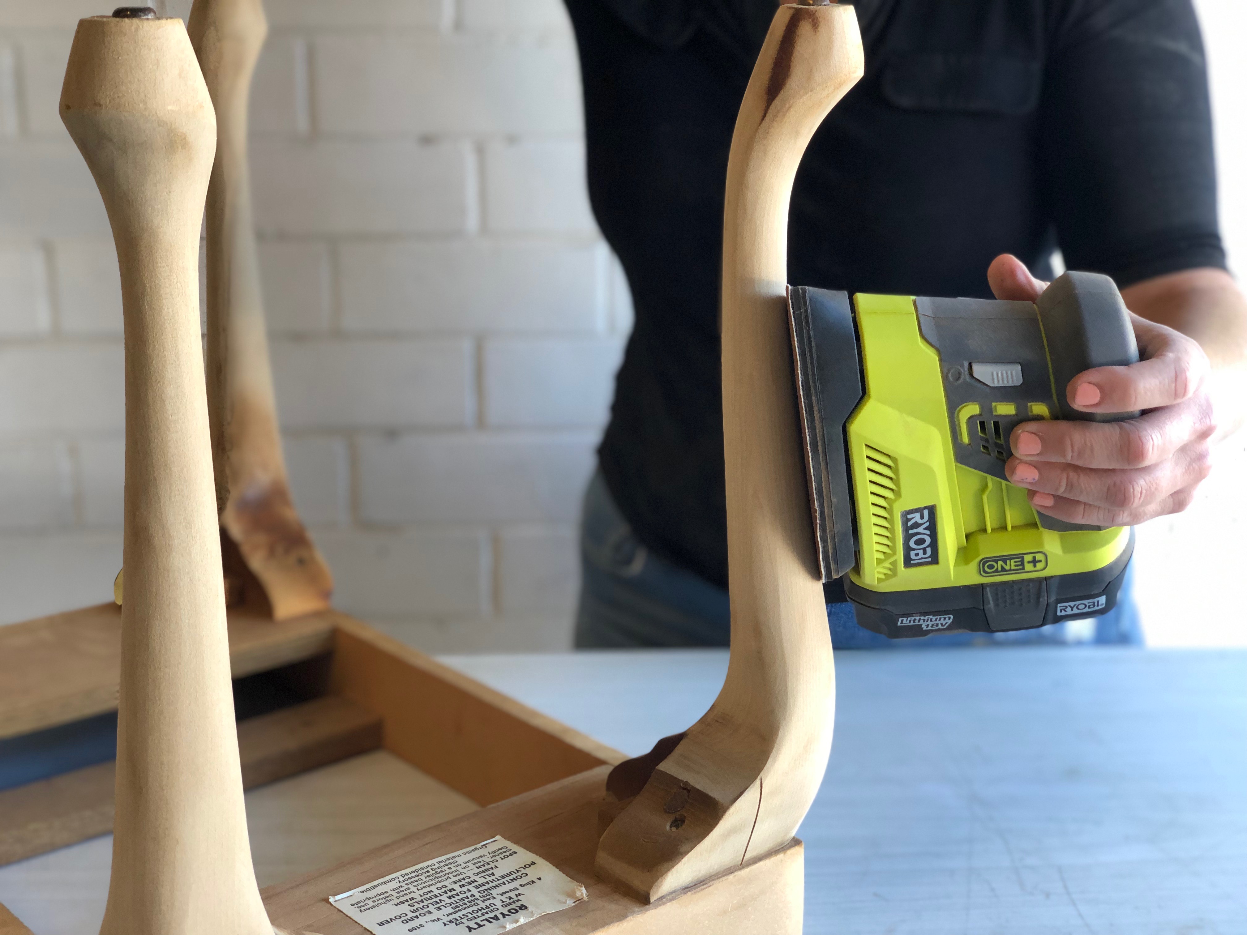 Using a Ryobi palm sander to remove varnish on vintage footstall