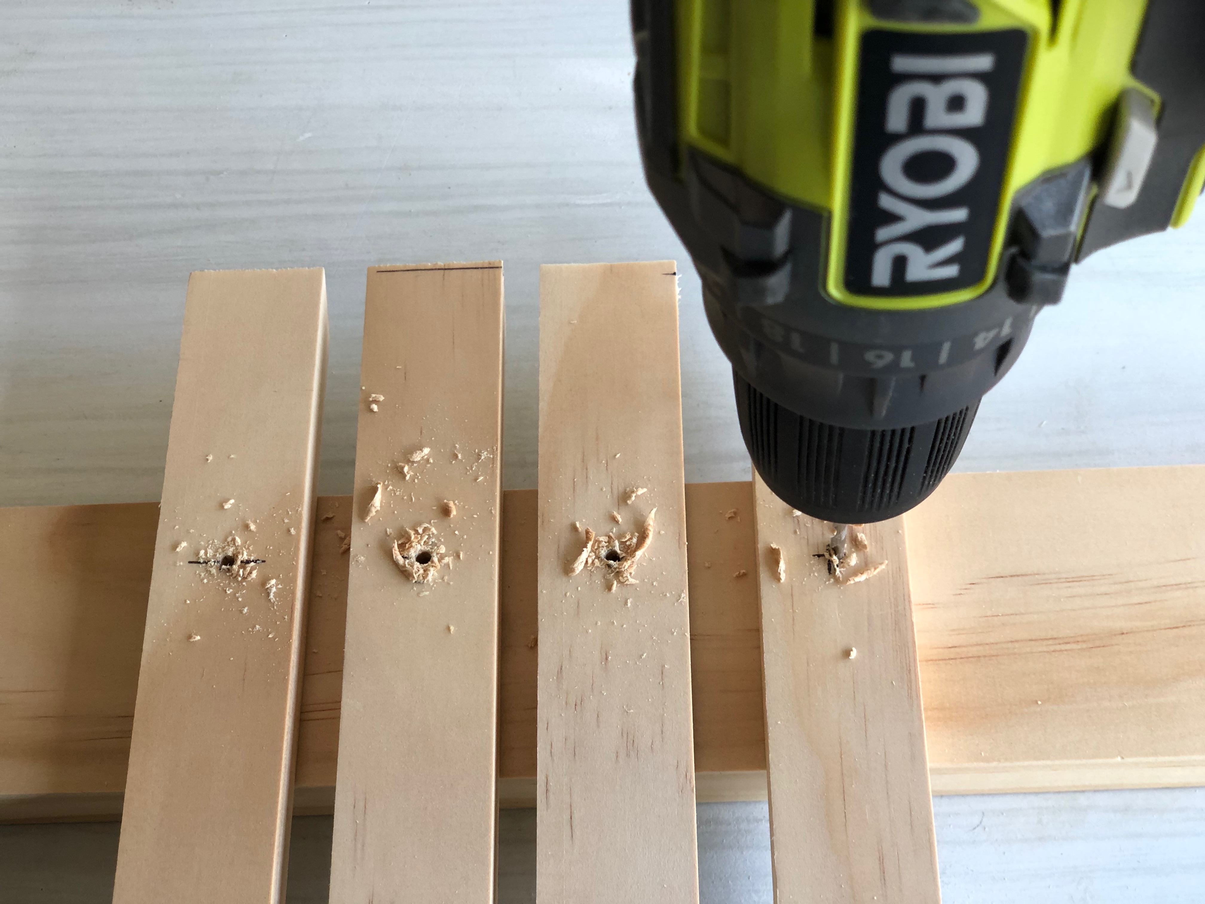 Drill pilot holes on each pine leg