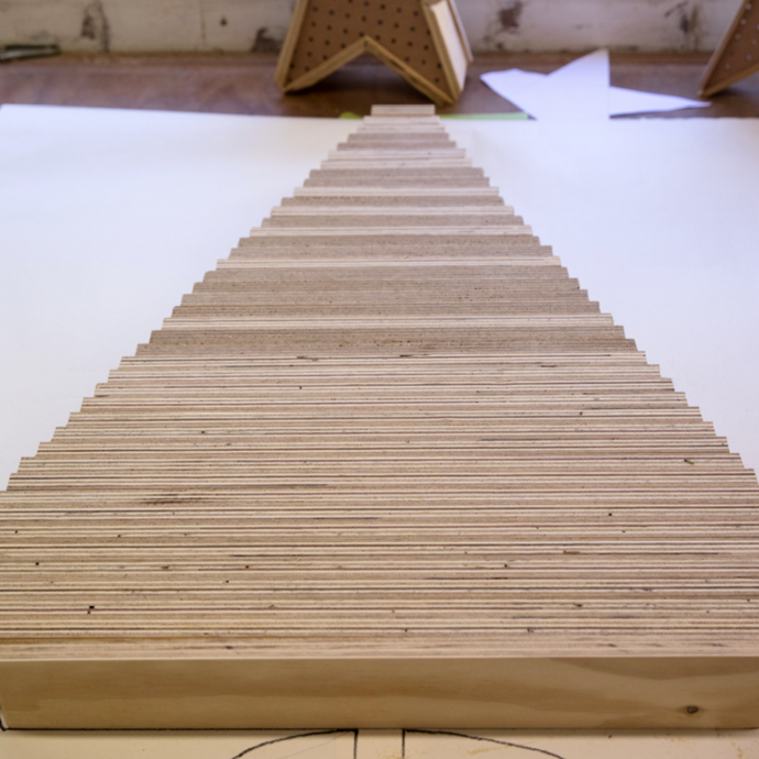 Wooden planks lined up to shape the Christmas tree