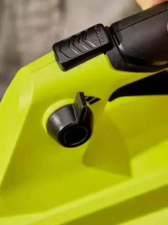 Close up of RYOBI garden blower handle with hand  