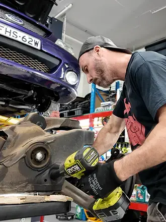 Mighty Car Mods team working on breaks